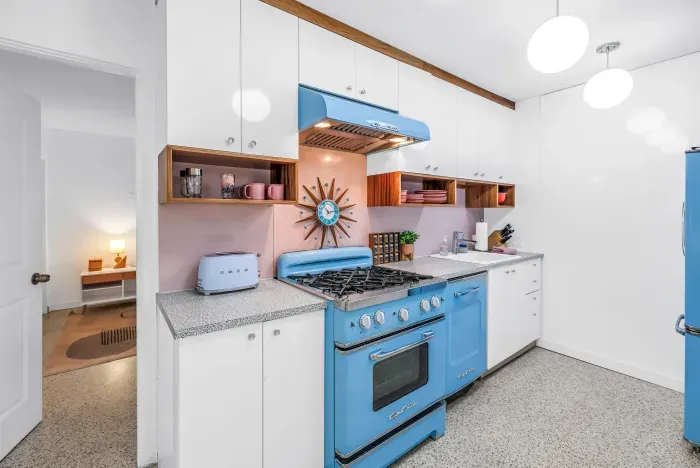 Charming retro-style kitchen with iconic blue range and bright modern finishes
