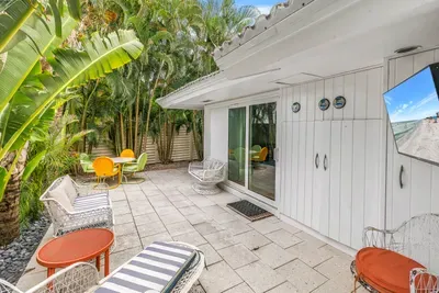 Private tropical patio with lounge seating and a relaxing coastal vibe