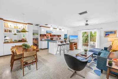 Bright open-plan living with stylish kitchen and private tropical courtyard
