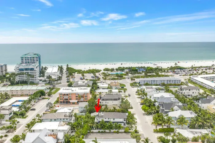 Walk to the beach from this tropical coastal retreat