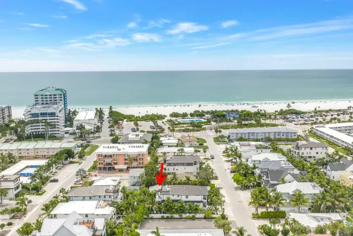 Walk to the beach from this tropical home near the Gulf shoreline