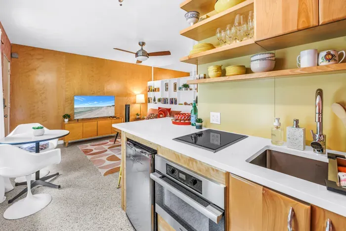 Bright mid-century studio with stylish kitchenette and cozy living area