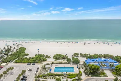 Sweeping beachfront views with pool access and pristine white sand