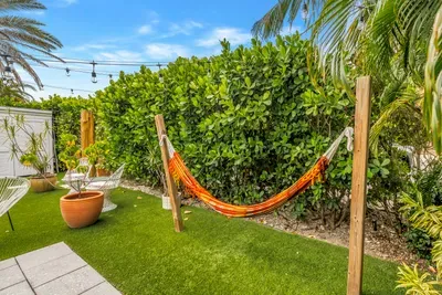 Private tropical garden with hammock and cozy resort-style seating