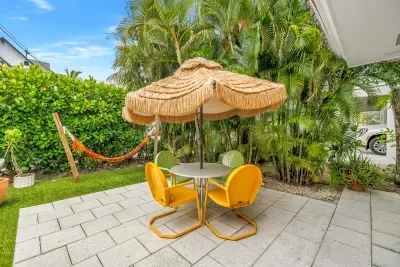 Tropical patio retreat with shaded seating and a relaxing hammock