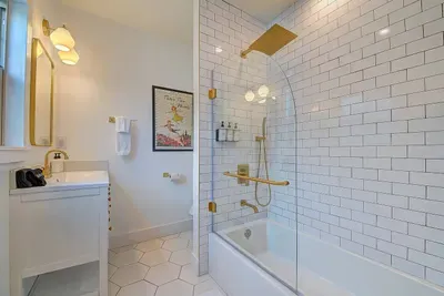 Bathroom attached to the Neverland Suite, includes a bathtub.