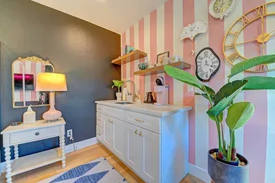 ️ Lose track of time in this whimsical retreat with a private entrance, kitchenette and ensuite.