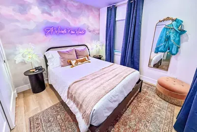 Neon nights, sky-high vibes, and a queen bed fit for royalty.