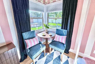 Time for the Mad Hatter's tea party! Or maybe a quiet spot to watch the kiddos splash in the pool while you catch up on email.