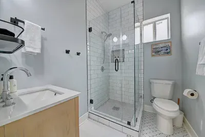 Rinse off the beach sand or just hide out in your spa-like shower.