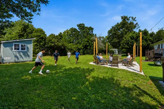 Spacious backyard with fire pit lounge and plenty of room for outdoor fun