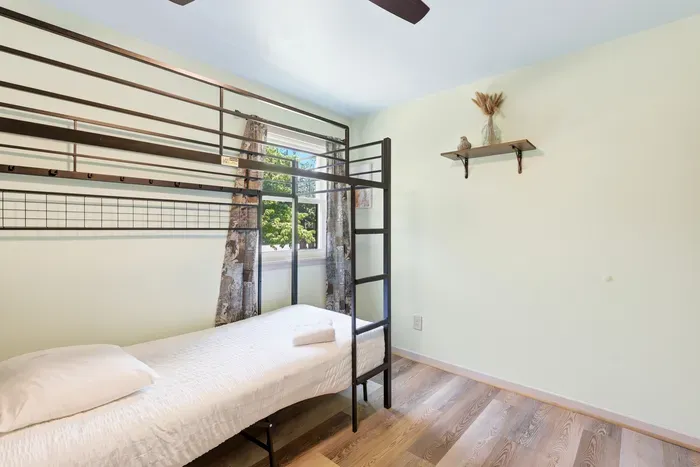Bright bunk room with natural light and clean, family-friendly setup