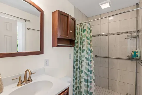 Shared bathroom with full shower and bath