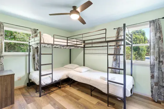Bright bunk room with sleeps for 4, sunny windows, and a clean modern feel