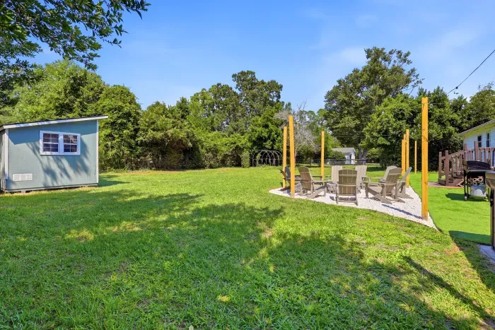 Spacious backyard with fire pit lounge, grill, and room to unwind