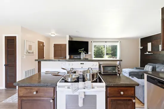 Bright open kitchen and cozy living space with natural light