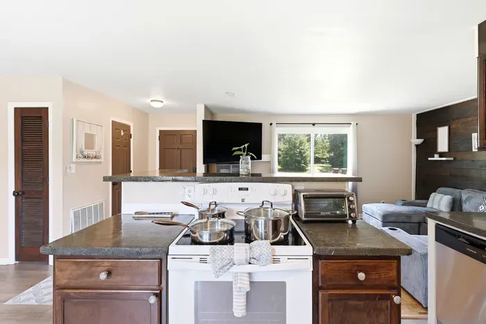 Bright open kitchen and cozy living space with natural light