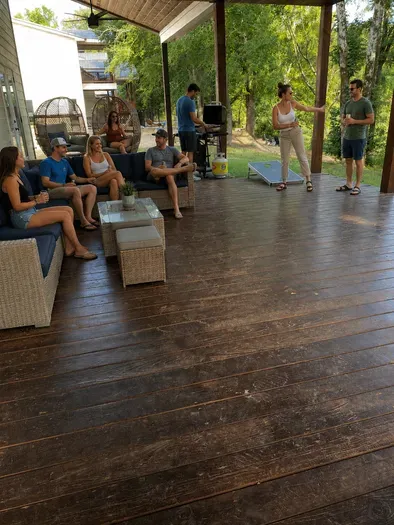 Spacious covered deck with lounge seating, grill & games for group fun