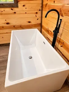 Modern soaking tub with rustic wood accents for a spa-like retreat