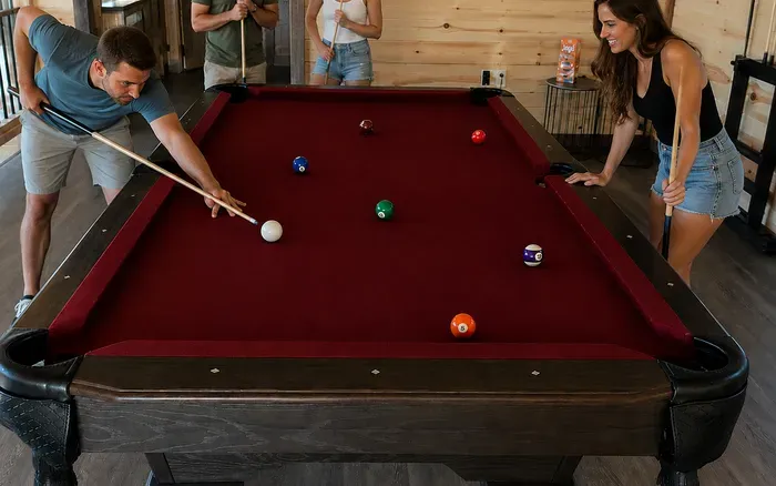 Fun-filled game room with full-size pool table and cozy lodge vibes