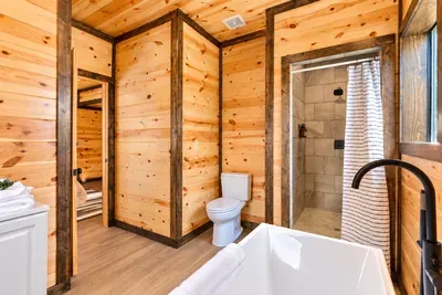 Rustic spa-style bathroom with soaking tub and walk-in shower