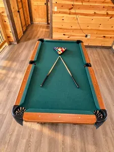 Rustic game room with pool table for cozy cabin fun