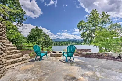 Imagine sitting here with this stunning view of the mountains, lake, and golf course all in one!