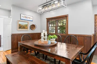 The dining table features its own light overhead and is a great space for games or dinner.