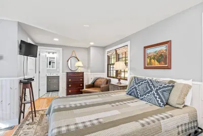 The upstairs bedroom features a dresser, closet, private bathroom, and closet. 