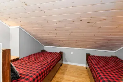 Two of the bunk beds are side-by-side and close to the ground, perfect for little ones. There is also a bed railing located in the closet for the more squirmy kids!