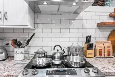 The kitchen comes equipped with all basic cooking utensils and appliances, including (but not limited to): Pots, pans, knives, spatulas, mixing bowls, cutting boards, and more!