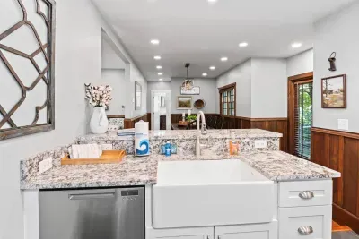 The open-concept kitchen flows seamlessly into the dining room making family meals easy.