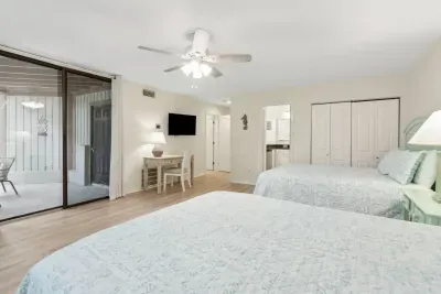 Walk out to your private patio straight from the secondary bedroom or draw the room-darkening shades for complete privacy.