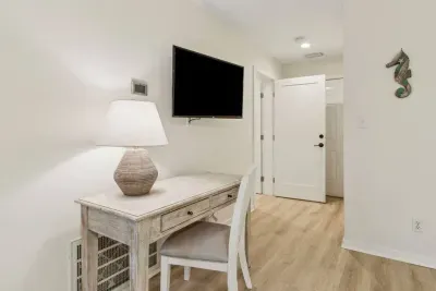 This bedroom features a work station in case you need to check in with the office while away. 