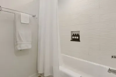 Enjoy the amenities with this bathroom! Shampoo, conditioner, and body wash are provided for your stay in addition to towels and wash cloths.