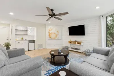 Pour a glass of wine and unwind in front of the TV in the family room. This Smart TV is equipped with Roku and integrates with all major streaming services, just log in and enjoy!