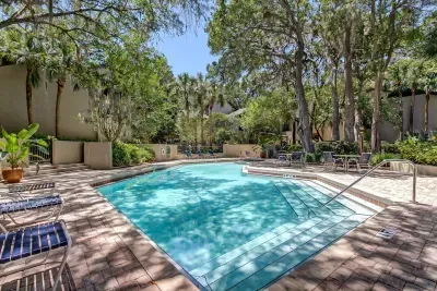 The shared community pool ranges from 3' to 5' deep with handrails and steps to assist in walking into the pool.