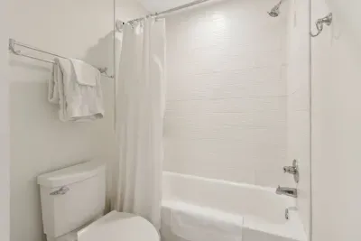 Shower off after a long day in this beautiful, bright shower/tub combo. Towels are included.