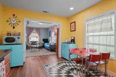 Enjoy meals in this cheerful vintage-inspired dining area, open to the cozy living room for easy gathering