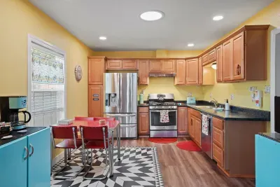 Step back in time in our retro kitchen, filled with vintage charm and colorful artwork. Enjoy coffee, tea, and cooking essentials like spices and oil—everything you need for a warm, homey meal with a dash of nostalgia