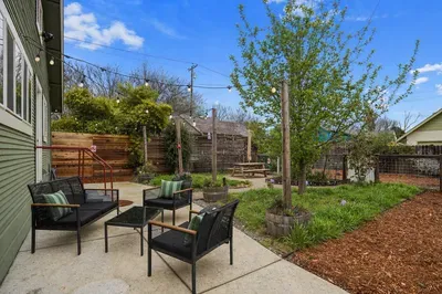 Enjoy the fully fenced backyard with a patio, picnic table, and comfortable seating—perfect for relaxing or spending time outdoors. The gated driveway provides secure parking for multiple cars, so you can settle in with peace of mind.