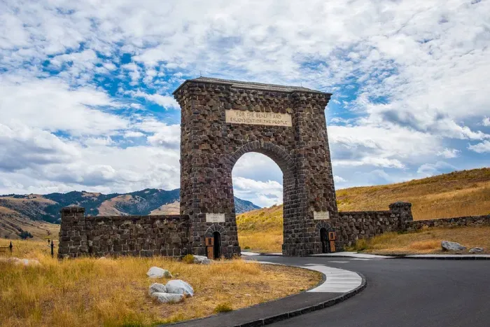 Step into history at Yellowstone's iconic Roosevelt Arch in Gardiner, MT. Built in 1903, it marks the park’s north entrance and welcomes visitors with the words “For the Benefit and Enjoyment of the People.” A must-see photo spot on your journey.