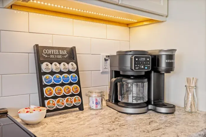 Wake up to coffee and Bridger views. The kitchen includes a dual Keurig + drip coffee maker, stocked pods, sweeteners, and everything you need for a quiet morning.