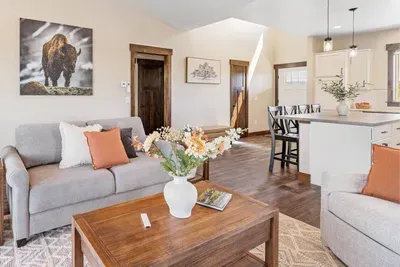 Stretch out on the comfy "Slofa" or one of two armchairs and enjoy the 55-inch Samsung Frame TV. This space was made for movie nights and quiet evenings by the fire.