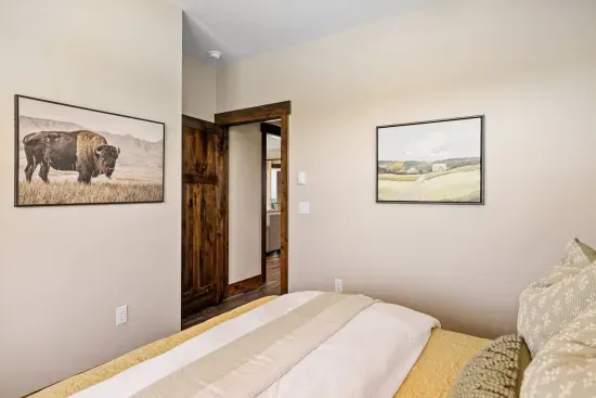 Wind down with sunset views, a comfortable bed, and a quiet corner of the cabin. You'll find everything you need for a great night's sleep, including a sound machine and phone charger in the nightstand drawer.