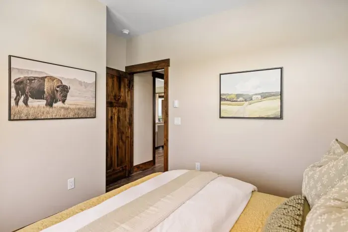 Wind down with sunset views, a comfortable bed, and a quiet corner of the cabin. You'll find everything you need for a great night's sleep, including a sound machine and phone charger in the nightstand drawer.