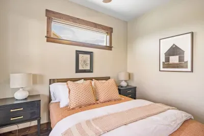 Your cozy retreat awaits. Unwind with quilted comforters, blackout shades, and a quiet setting made for deep sleep. The room also has a ceiling fan, sound machine, and a private door leading to the covered deck.