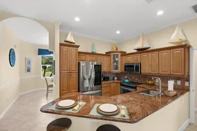 Kitchen: Cook up coastal cuisine in this bright, boat-themed kitchen with modern appliances!