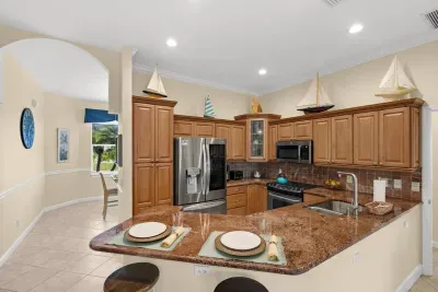 Kitchen: Cook up coastal cuisine in this bright, boat-themed kitchen with modern appliances!
