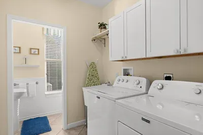 Laundry Room: Bright and functional space with modern appliances for all your beachwear needs!